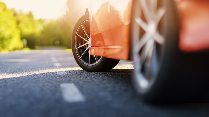Red car on asphalt road