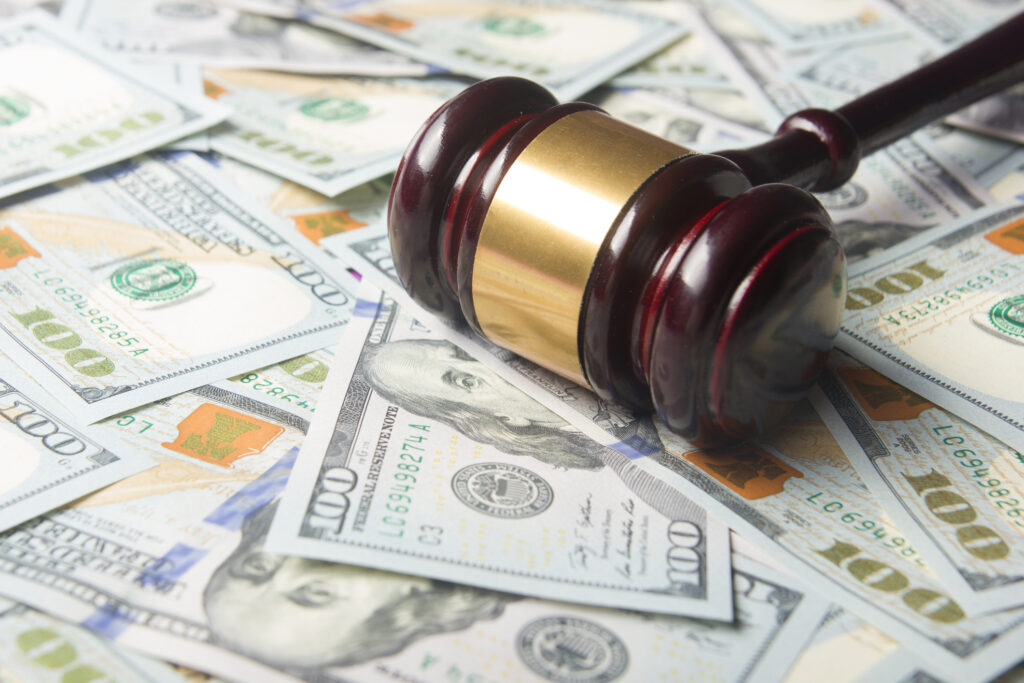 Judges Or Auctioneer Gavel On The Dollar Cash Background