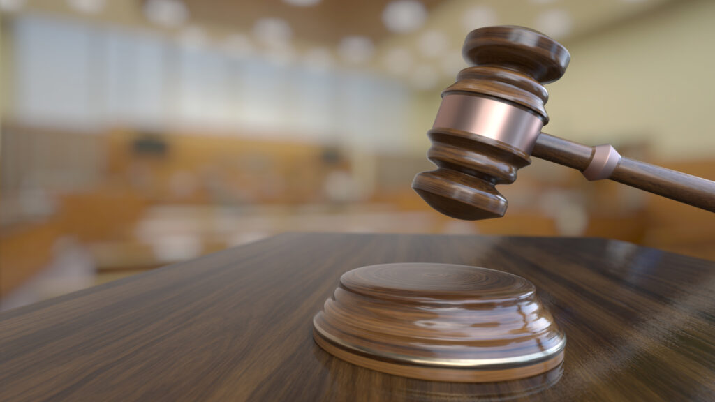 Wooden judge gavel, close-up view.