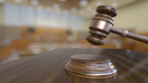 Wooden judge gavel, close-up view.