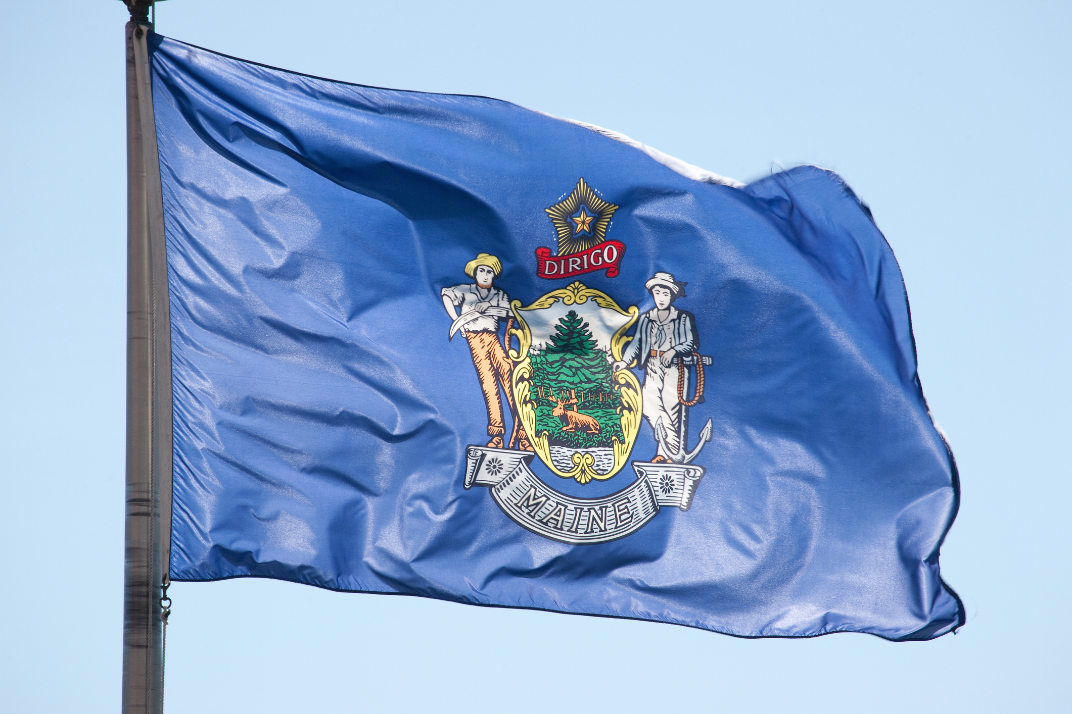 Maine State Flag in Blue Sky