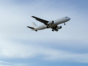 Low angle view of airplane flying against sky,Tallinn Airport,Estonia