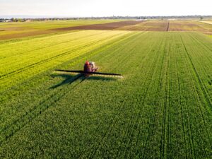 Tractor spraying crops
