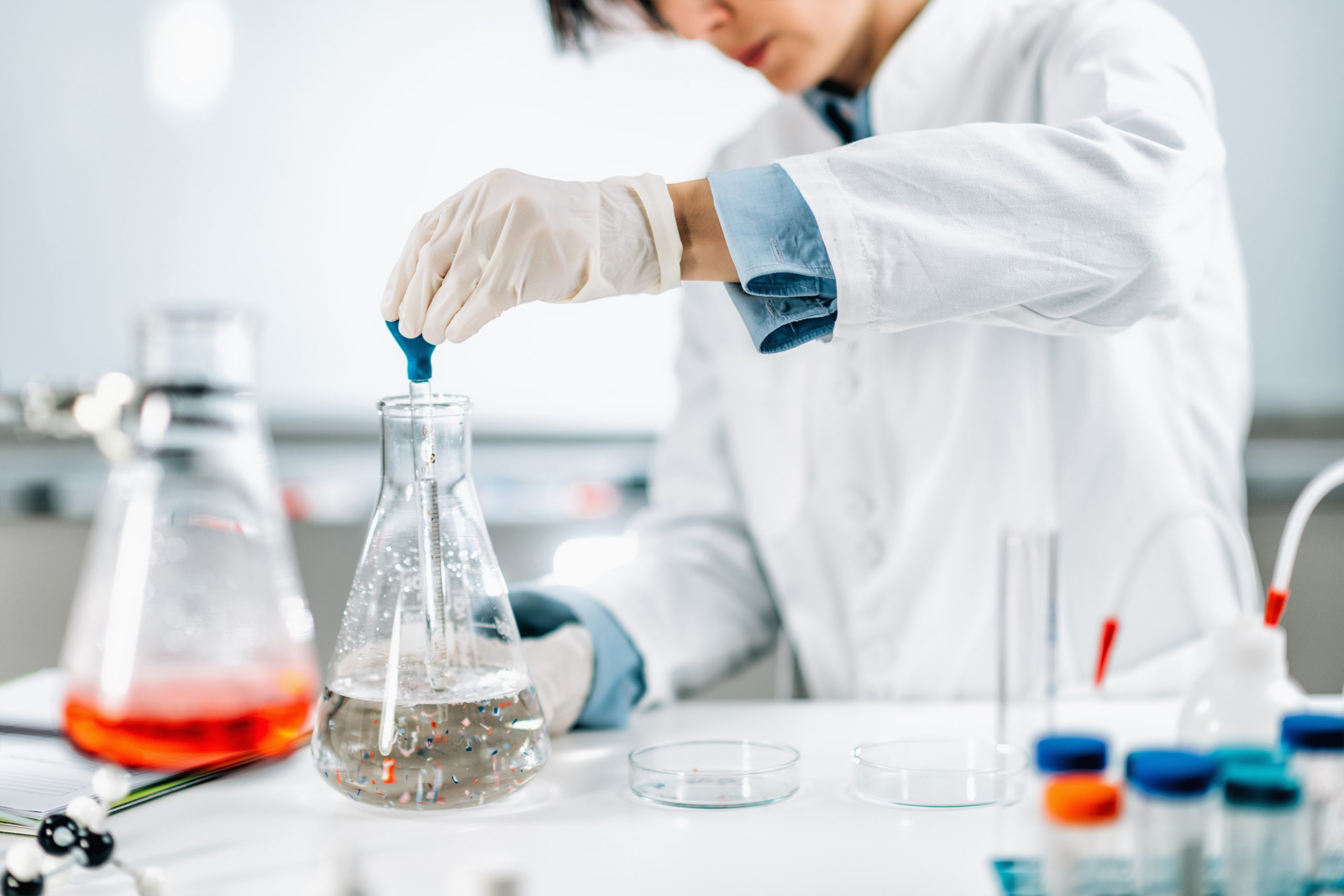 Scientist with beaker