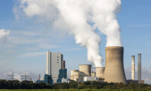 Large coal fired power plant with smoking chimneys