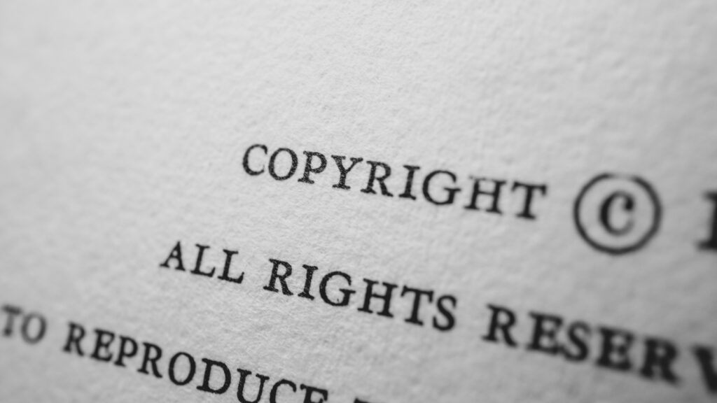 Copyright All Rights Reserved Law Text on Paper Minimal with C Symbol Macro Photo Close-up